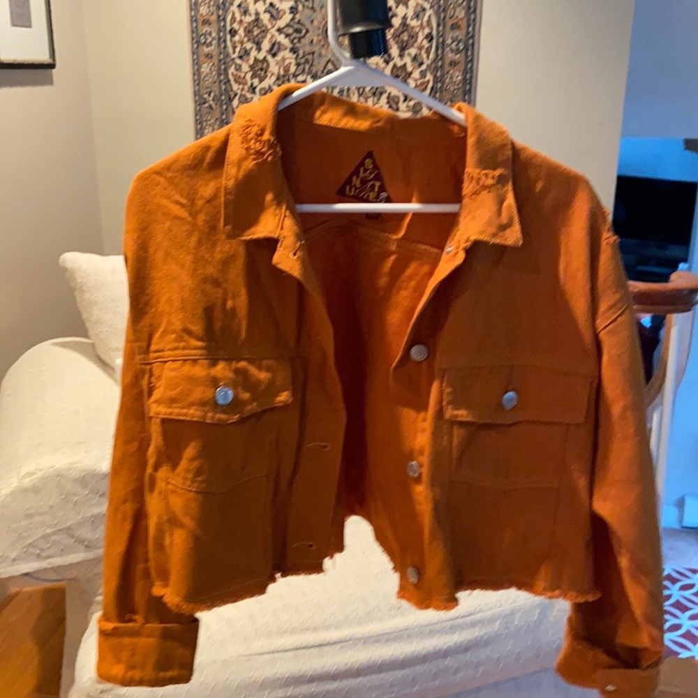 Distressed cropped burnt orange denim jacket